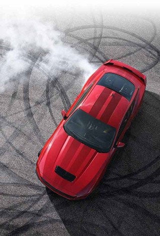 Overhead view of a 2024 Ford Mustang® model with tire tracks on pavement | Ed Morse Ford St. Robert in Saint Robert MO