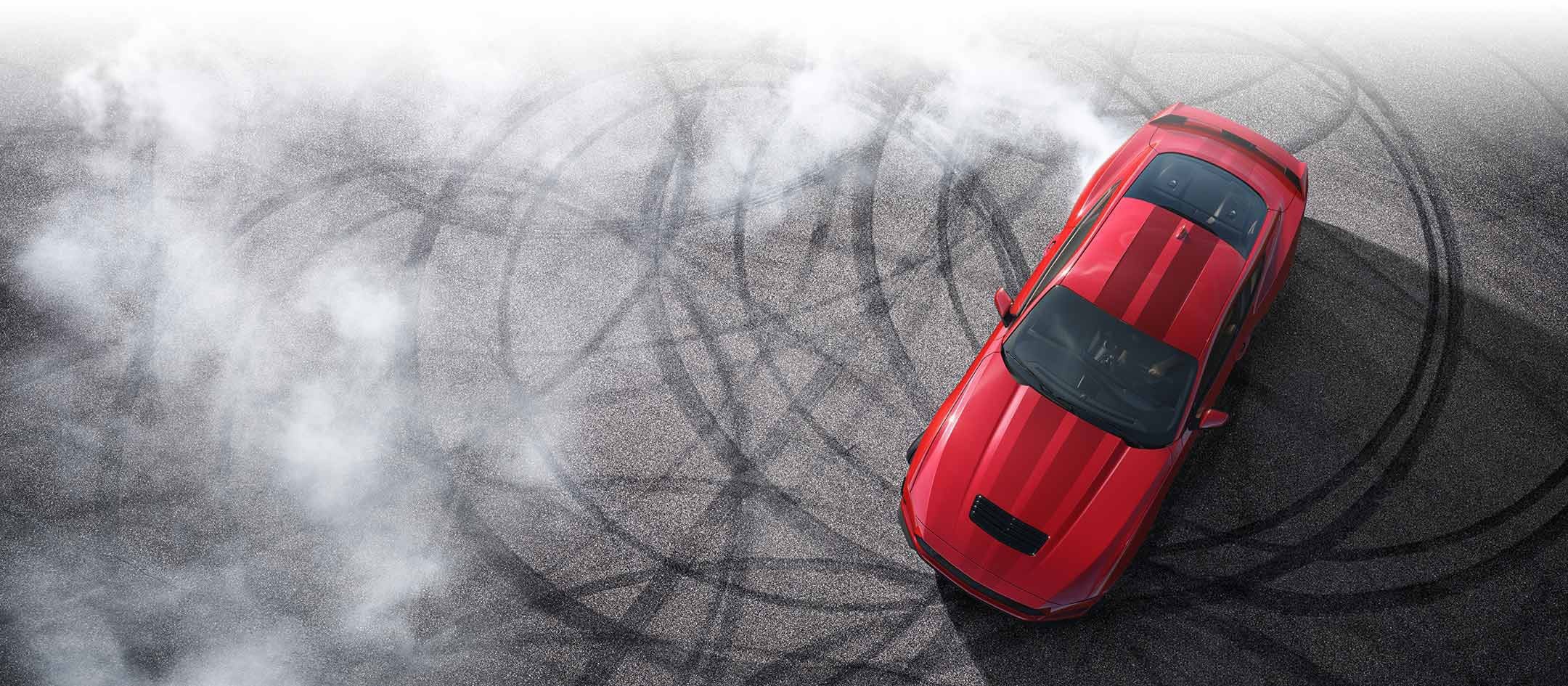 Overhead view of a 2024 Ford Mustang® model with tire tracks on pavement | Ed Morse Ford St. Robert in Saint Robert MO